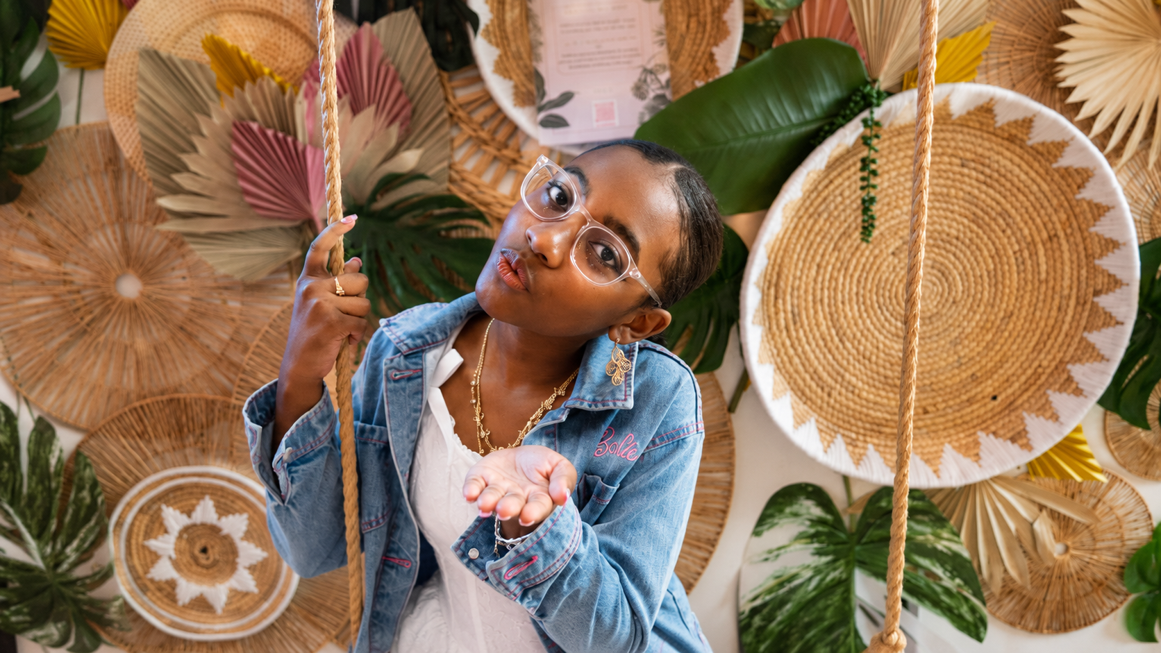 Creative studio portrait against a textured woven backdrop